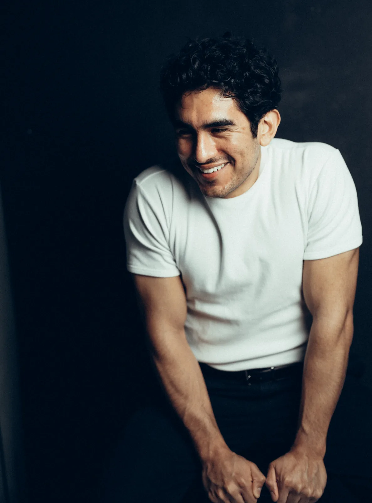 Lenny Ramos candid portrait, laughing, white t-shirt